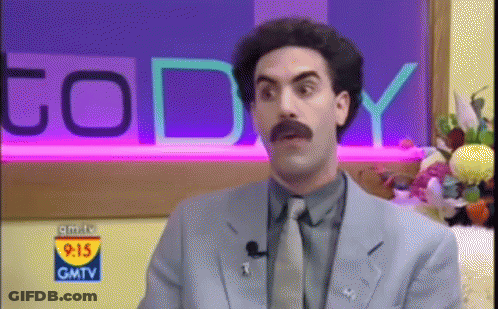 A Man In A Suit And Tie Is On Gmtv GIF