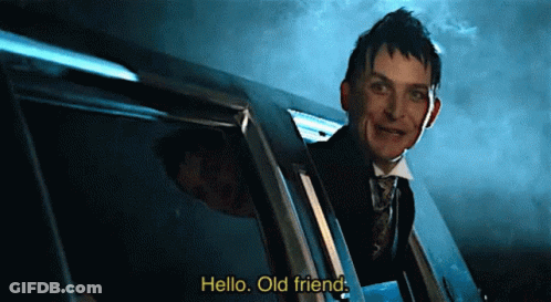 A Man In A Suit And Tie Is Peeking Out Of A Car Window And Says Hello Old Friend GIF