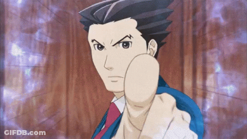A Man In A Suit And Tie Is Pointing At Something GIF