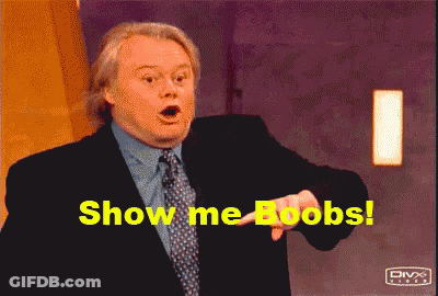 A Man In A Suit And Tie Is Pointing At The Camera And Says Show Me Boobs GIF