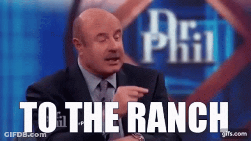 A Man In A Suit And Tie Is Pointing At The Camera And Says `` To The Ranch '' . GIF