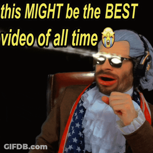 A Man In A Suit And Tie Is Pointing At The Camera With The Words " This Might Be The Best Video Of All Time " Behind Him GIF