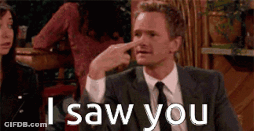 A Man In A Suit And Tie Is Pointing His Finger At His Nose And Says I Saw You GIF