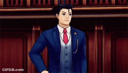 A Man In A Suit And Tie Is Pointing His Finger At The Camera . GIF