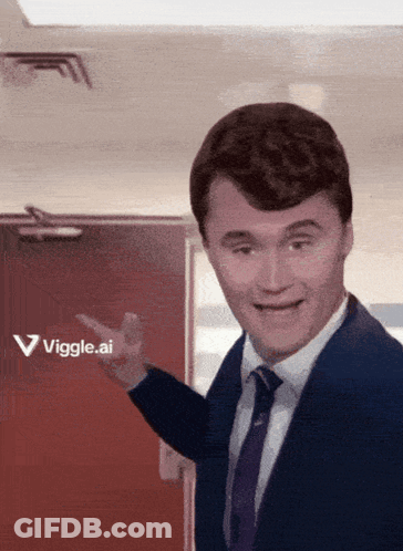 A Man In A Suit And Tie Is Pointing To A Red Door That Says Vigge.ai GIF