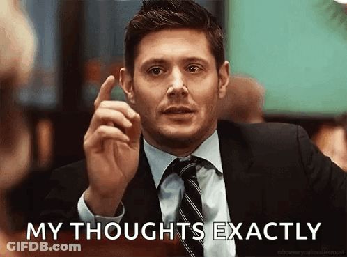 A Man In A Suit And Tie Is Pointing Up And Saying His Thoughts Exactly GIF