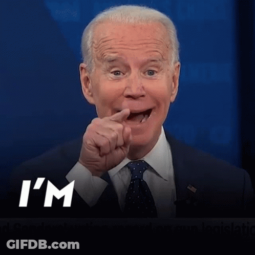 A Man In A Suit And Tie Is Pointing With The Words I 'M Coming Below Him GIF