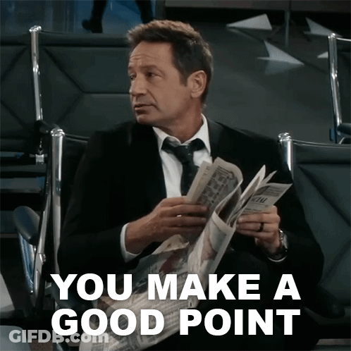 A Man In A Suit And Tie Is Reading A Newspaper With The Words " You Make A Good Point " Above Him GIF
