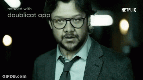 A Man In A Suit And Tie Is Refaced With A Doublecat App . GIF
