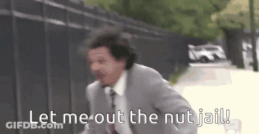A Man In A Suit And Tie Is Running Down A Street And Says `` Let Me Out The Nut Jail '' . GIF