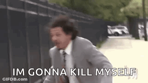 A Man In A Suit And Tie Is Running Down A Street While Saying `` Im Gonna Kill Myself '' . GIF
