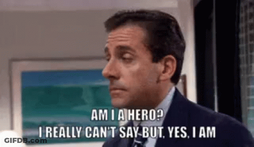 A Man In A Suit And Tie Is Saying `` Am I A Hero ? `` GIF