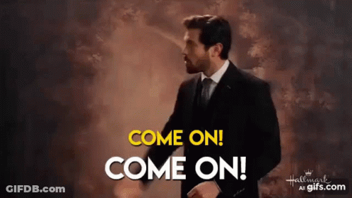 A Man In A Suit And Tie Is Saying Come On Come On . GIF
