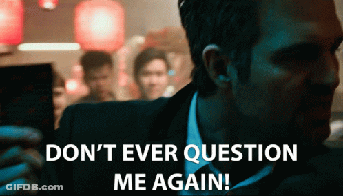 A Man In A Suit And Tie Is Saying " Do N't Ever Question Me Again " GIF