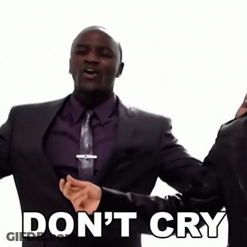 A Man In A Suit And Tie Is Saying " Don 'T Cry " GIF
