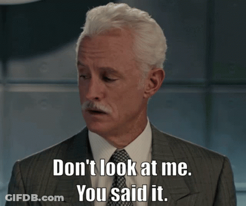 A Man In A Suit And Tie Is Saying " Don 'T Look At Me You Said It " GIF