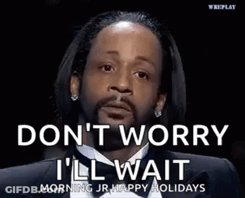 A Man In A Suit And Tie Is Saying `` Don T Worry I 'Ll Wait '' . GIF