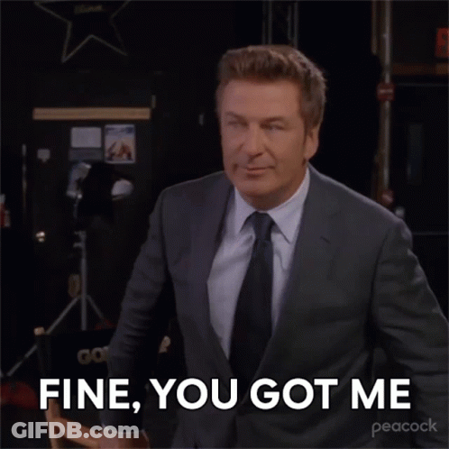 A Man In A Suit And Tie Is Saying " Fine You Got Me " GIF