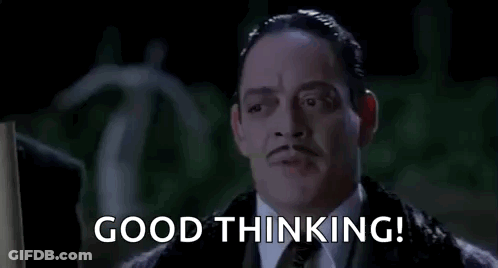 A Man In A Suit And Tie Is Saying `` Good Thinking '' In A Movie . GIF