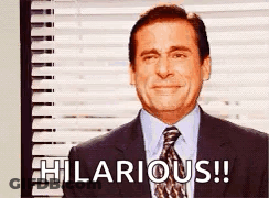 A Man In A Suit And Tie Is Saying Hilarious . GIF