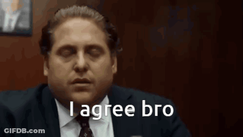 A Man In A Suit And Tie Is Saying `` I Agree Bro '' While Sitting In A Chair . GIF