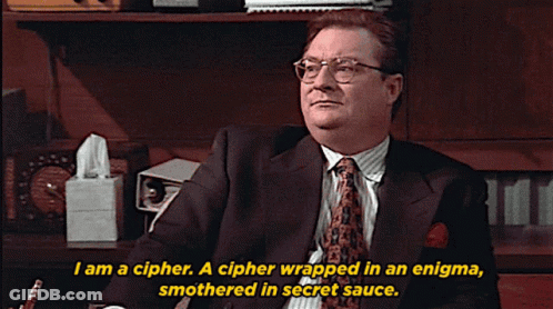 A Man In A Suit And Tie Is Saying I Am A Cipher GIF
