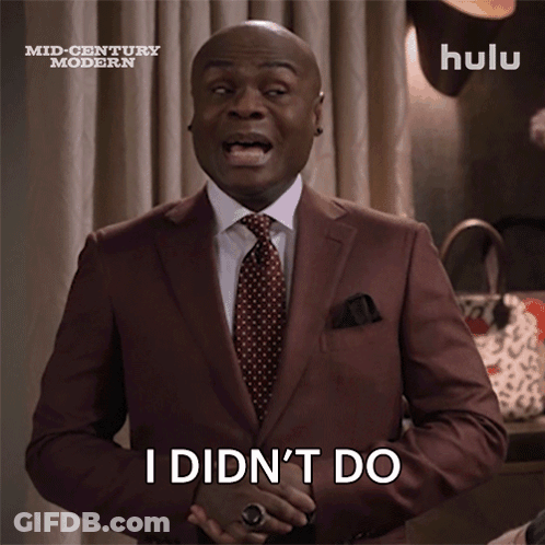 A Man In A Suit And Tie Is Saying " I Did N't Do Anything " GIF