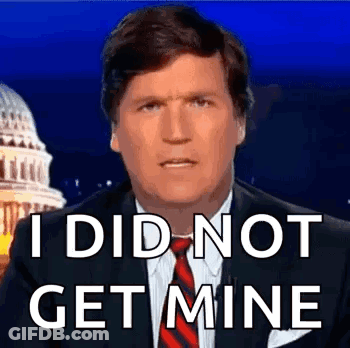 A Man In A Suit And Tie Is Saying `` I Did Not Get Mine '' While Standing In Front Of The Capitol Building . GIF