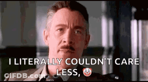 A Man In A Suit And Tie Is Saying `` I Literally Could N't Care Less '' . GIF