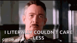 A Man In A Suit And Tie Is Saying `` I Literally Couldn 'T Care Less '' GIF