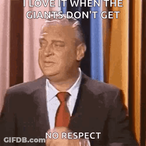 A Man In A Suit And Tie Is Saying I Love It When The Giants Don 'T Get No Respect GIF