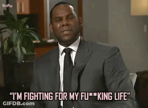 A Man In A Suit And Tie Is Saying `` I 'M Fighting For My Fu * King Life '' . GIF