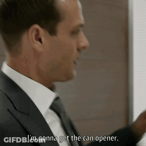 A Man In A Suit And Tie Is Saying I 'M Gonna Get The Can Opener GIF