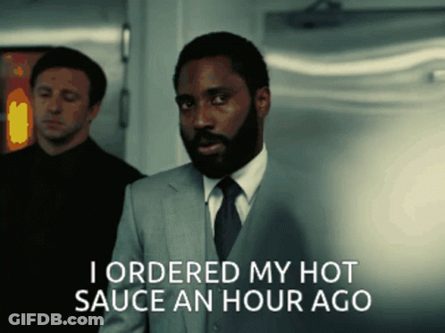 A Man In A Suit And Tie Is Saying I Ordered My Hot Sauce An Hour Ago GIF