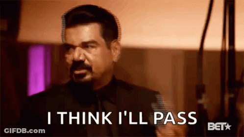 A Man In A Suit And Tie Is Saying `` I Think I 'Ll Pass '' In A Blurry Photo . GIF