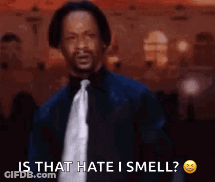 A Man In A Suit And Tie Is Saying `` Is That Hate I Smell? '' GIF