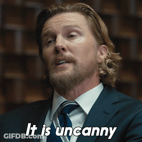 A Man In A Suit And Tie Is Saying " It Is Uncanny " GIF