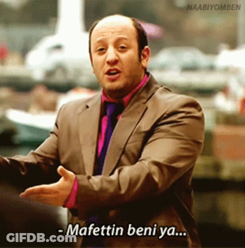 A Man In A Suit And Tie Is Saying Mafettin Beni Ya GIF