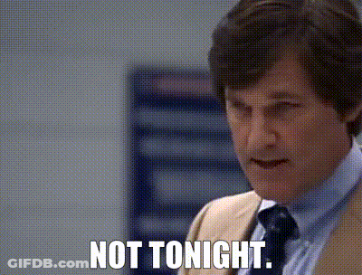A Man In A Suit And Tie Is Saying " Not Tonight " GIF