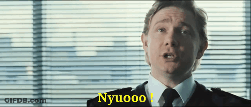 A Man In A Suit And Tie Is Saying Nyuoo GIF