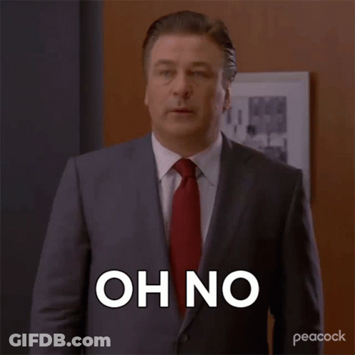 A Man In A Suit And Tie Is Saying Oh No . GIF