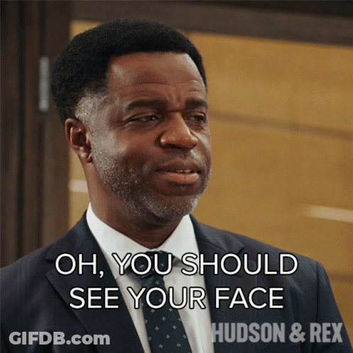 A Man In A Suit And Tie Is Saying Oh You Should See Your Face GIF