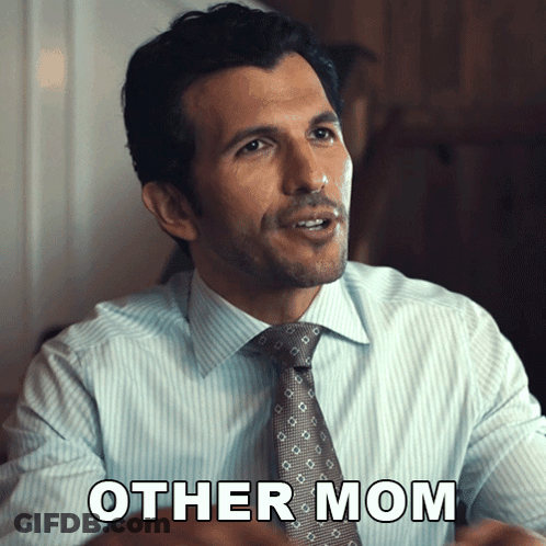 A Man In A Suit And Tie Is Saying Other Mom GIF