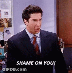 A Man In A Suit And Tie Is Saying Shame On You ! GIF