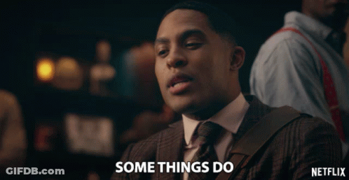 A Man In A Suit And Tie Is Saying Somethings Do GIF