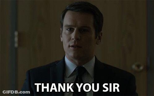 A Man In A Suit And Tie Is Saying " Thank You Sir " GIF
