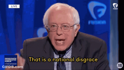 A Man In A Suit And Tie Is Saying That Is A National Disgrace . GIF