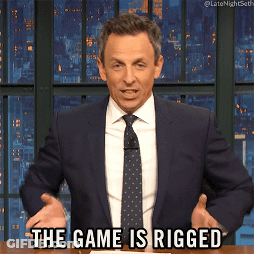 A Man In A Suit And Tie Is Saying " The Game Is Rigged " GIF
