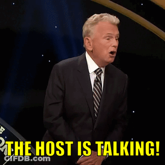 A Man In A Suit And Tie Is Saying " The Host Is Talking " GIF