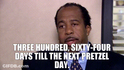 A Man In A Suit And Tie Is Saying Three Hundred Sixty-Four Days Till The Next Pretzel Day . GIF